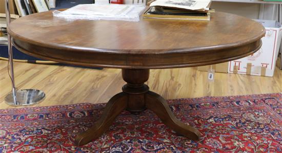 A tripod base circular top dining table 166cm